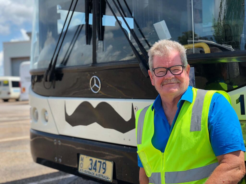 Andrew Smiling In Front Of The Bus