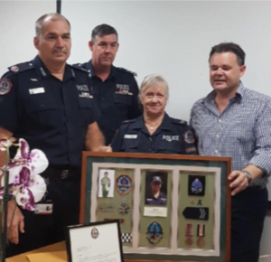 Kim Being Awarded A National Police Service Medal