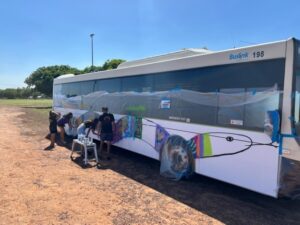 One Side Of The Bus Was Painted With A Brightly Coloured Snake